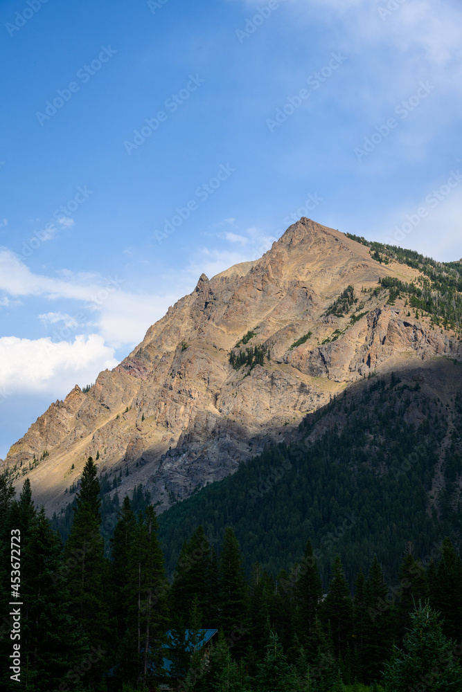 Sharp mountain peak on a sunny blue sky day, Cooke City, Montana, USA
