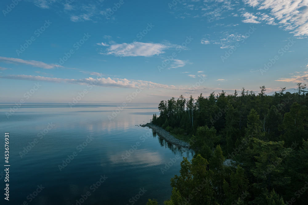 Summertime imagery of Lake Baikal in morning is a rift lake located in southern Siberia, Russia. Baikal lake summer landscape view. Drone's Eye View.