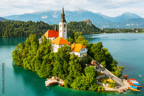 Aerial view of lake Bled with assumption of Mary Pilgrimage Church on the small island on the background of Julian Alps in Slovenia 