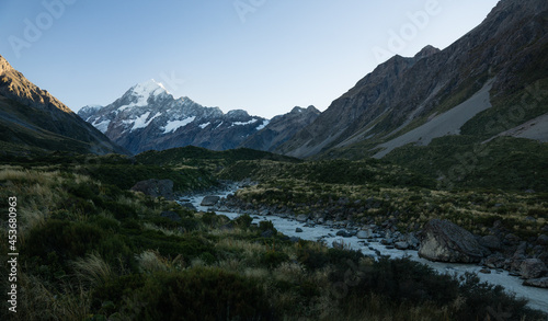 photo of mt cook in new zealand with a river in the foreground