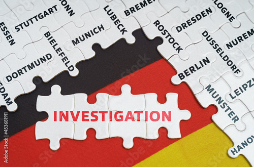 On the flag of Germany there are puzzles with the names of cities and puzzles with the inscription - Investigation