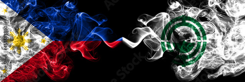 Philippines, Filipino vs Japan, Japanese, Oketo, Hokkaido, Okhotsk, Subprefecture smoke flags side by side. photo