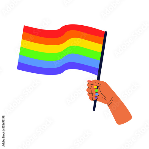 Vector illustration of a hand holding a rainbow flag, a symbol of the LGBT community. The concept of celebrating the International Day against Homophobia. The pride flag isolated on a white background