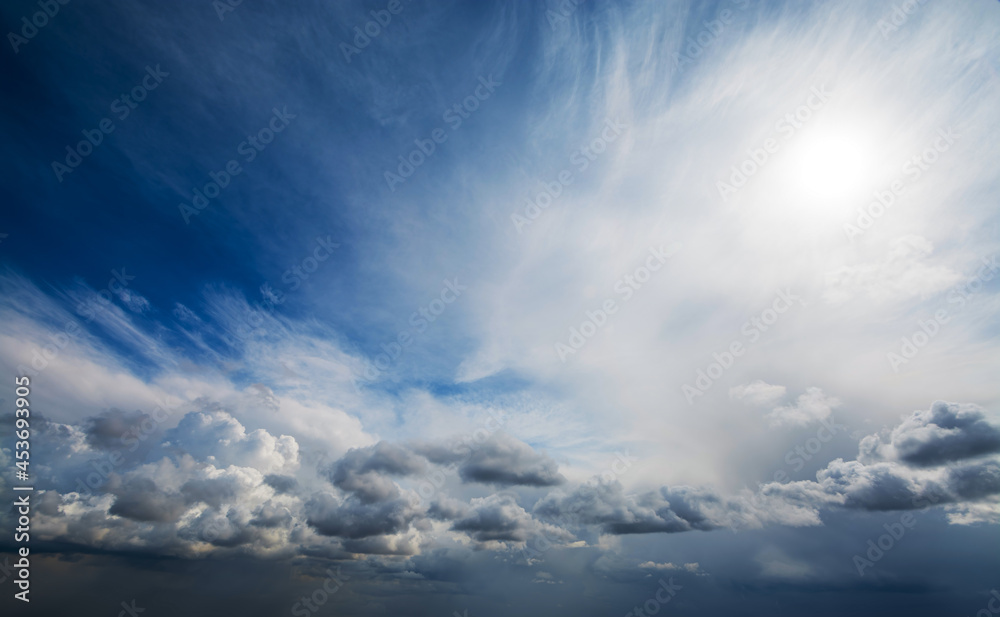 Obraz premium Picturesque aerial view of changing weather from clear blue sky with bright sunshine and just a few white clouds to dark stormy thunderclouds completely covering the sky.