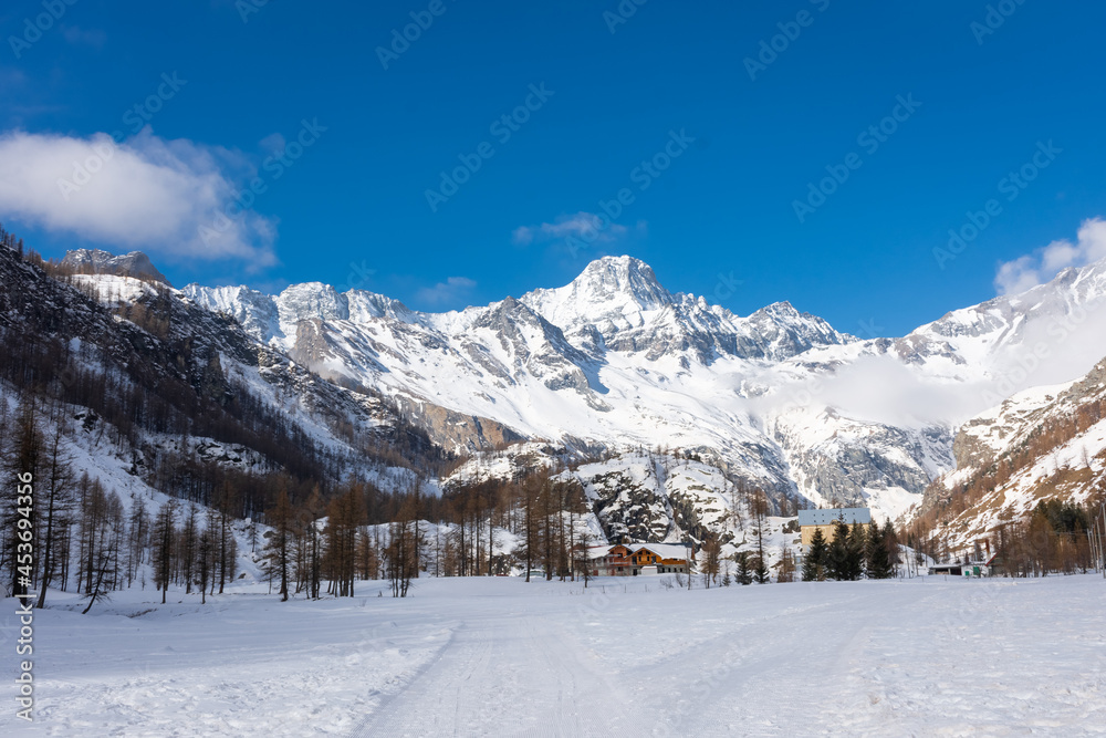 Fototapeta premium Snowy landscape in Pian della Mussa mountain, Piedmont, Italy