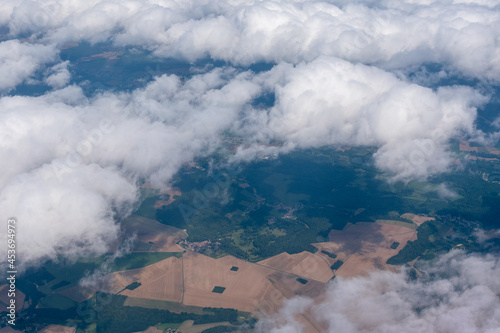 Fields in France as seen from the air through light clouds