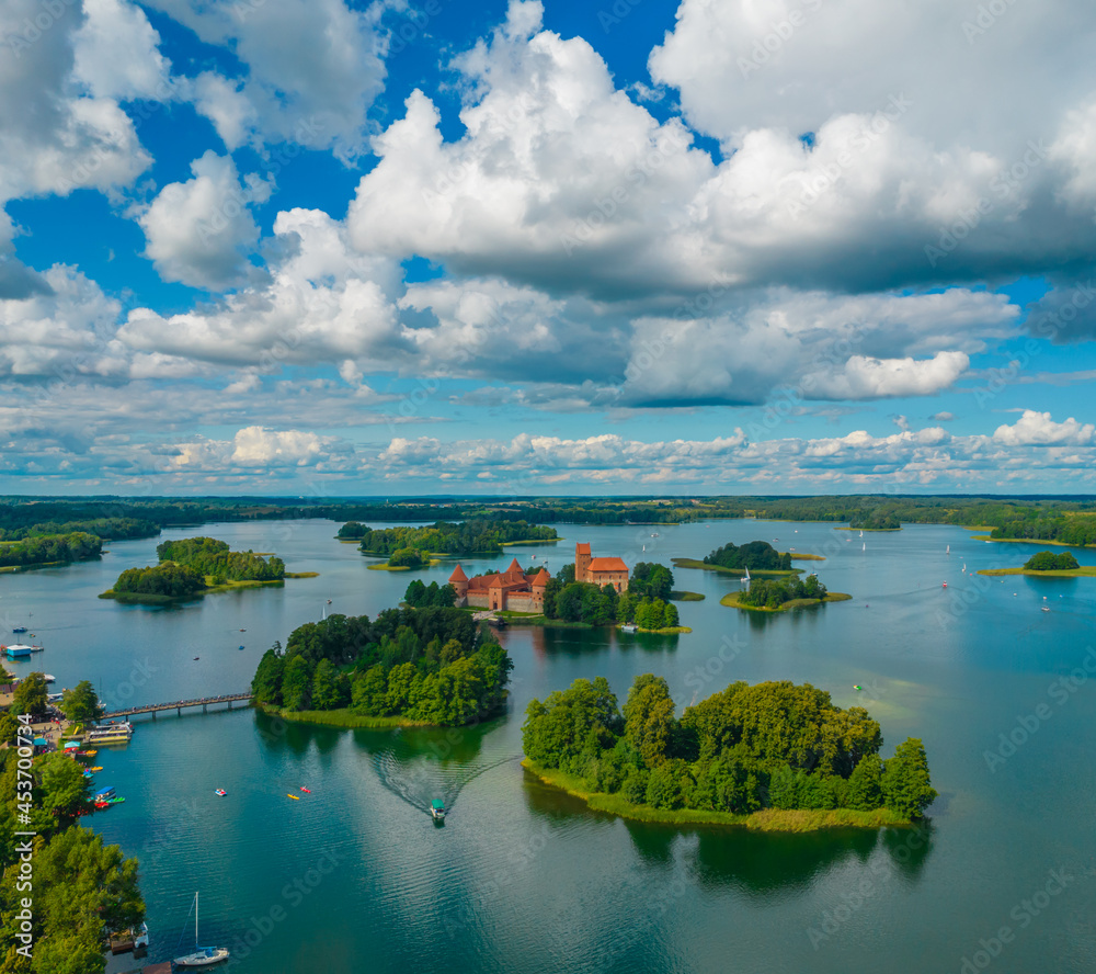 Aerial view of Trakai Island Castle - a medieval gothic castle located in Lithuania, on an island in Lake Galve. The construction begun in the 14th century and around 1409 major works were completed