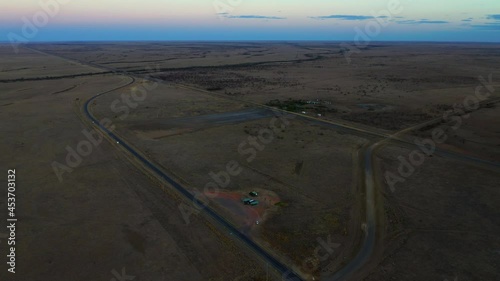 Panoramic View Of The Asphalt Roads Amidst The Vast Land During Sunset In Queensland, Australia. aerial photo