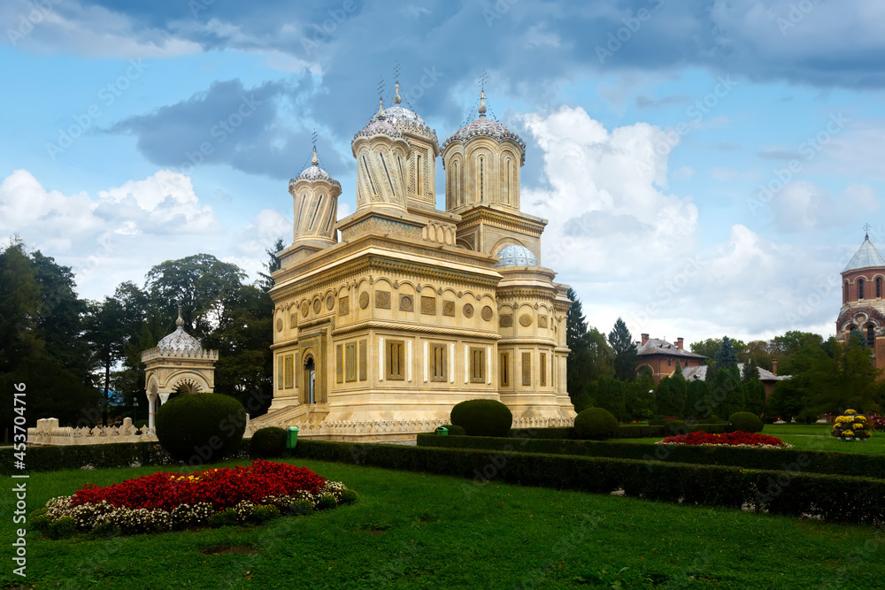 View of Romanian Orthodox Cathedral of Curtea de Arges in sunny autumn day