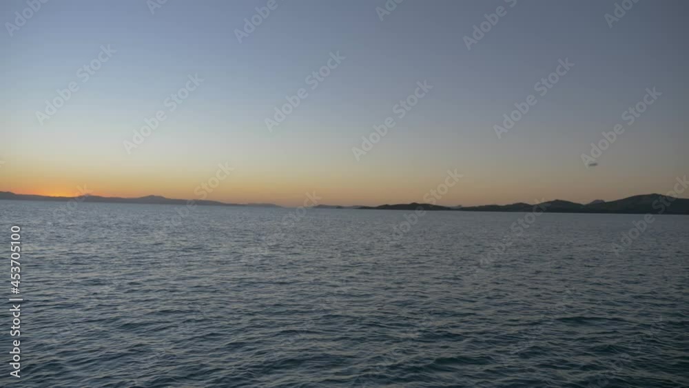 Panoramic View Of The Islands At Whitsundays During Golden Sunset In Queensland, Australia. wide shot Panoramic View Of The Islands At Whitsundays During Golden Sunset In Queensland, Australia. wide shot