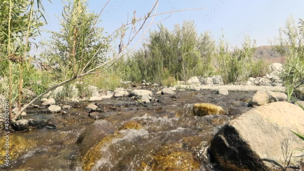 A River Flowing over Rocks with a Reverse Filter for Interesting Effect A River Flowing over Rocks with a Reverse Filter for Interesting Effect