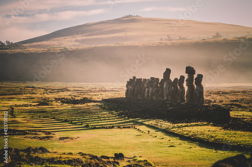 Sunrise over Moai stone sculptures at Ahu Tongariki, Easter island, Chile. photo