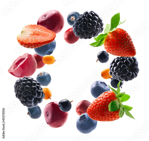 Fototapeta Naklejka Na Ścianę i Meble -  Many different berries in the form of a frame on a white background