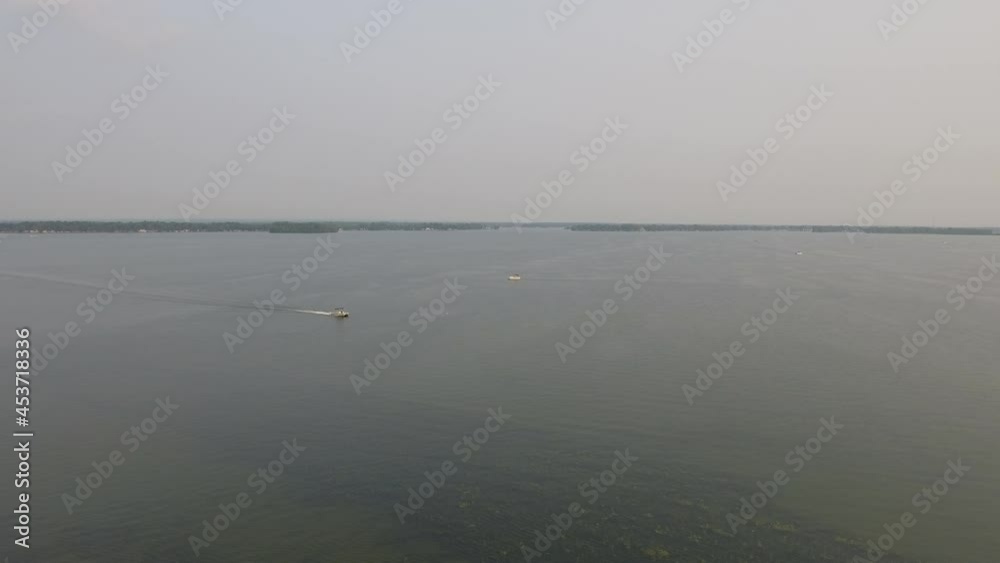 Wide drone shot of Indian Lake in Ohio with boats on the water Wide drone shot of Indian Lake in Ohio with boats on the water