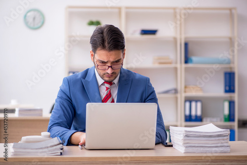 Young attractive employee working in the office