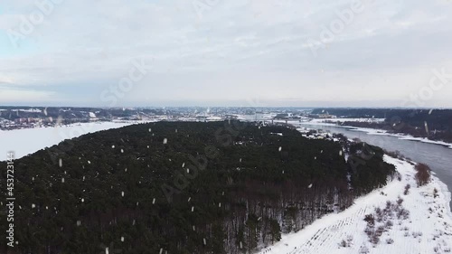 Wallpaper Mural Beautiful forest and vast river of Nemumas in winter season during snowfall, aerial view Torontodigital.ca
