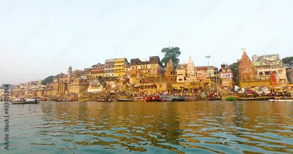 River Ganges in Varanasi with Buildings Lit in the Morning Sunrise in India. River Ganges in Varanasi with Buildings Lit in the Morning Sunrise in India.