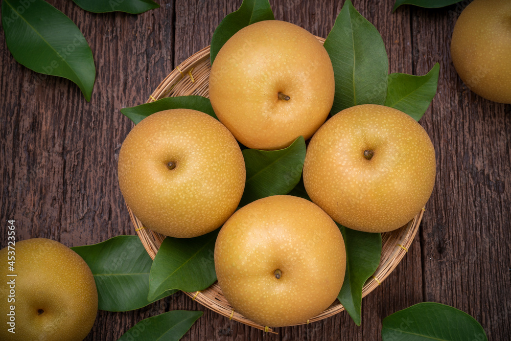 Snow pear or Shingo pear on a wooden background, Nashi pear fruits delicious and sweet on wooden background.