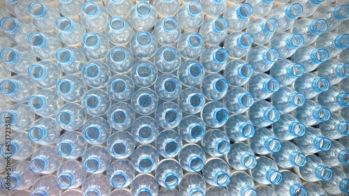 blue clear plastic unfilled drinking water bottle.