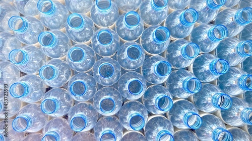 blue clear plastic unfilled drinking water bottle.