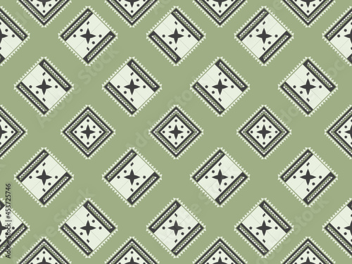 Geometric seamless ethnic traditional pattern in swithing rectangle style and crossing stripe line zigzag. Color of green tone. Design fabric background wallpaper vector carpet.