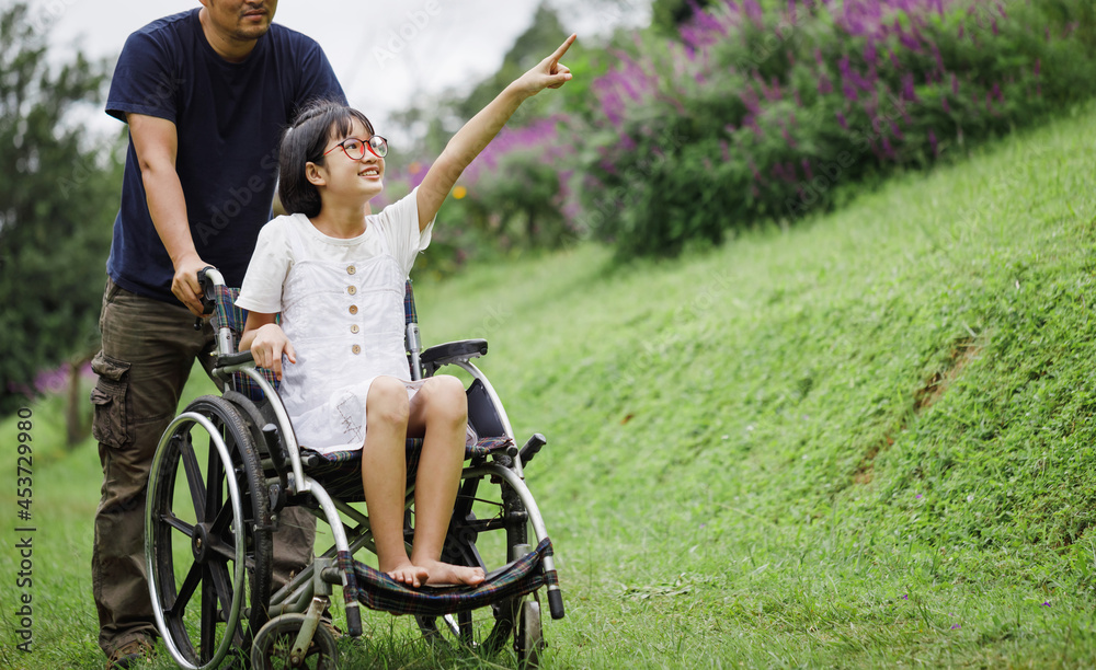 custom made wallpaper toronto digitalFather and Disabled child on wheelchair walking on trail meadow park in sunny day. Happy disability kid travel in family holiday concept.