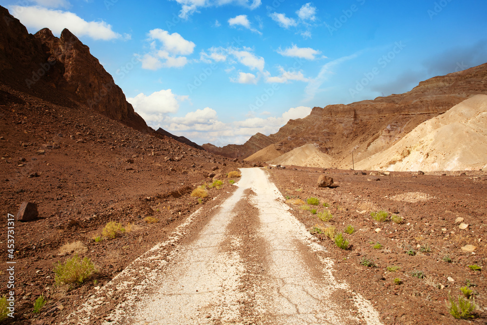 old asphalt road in the desert of the Negev