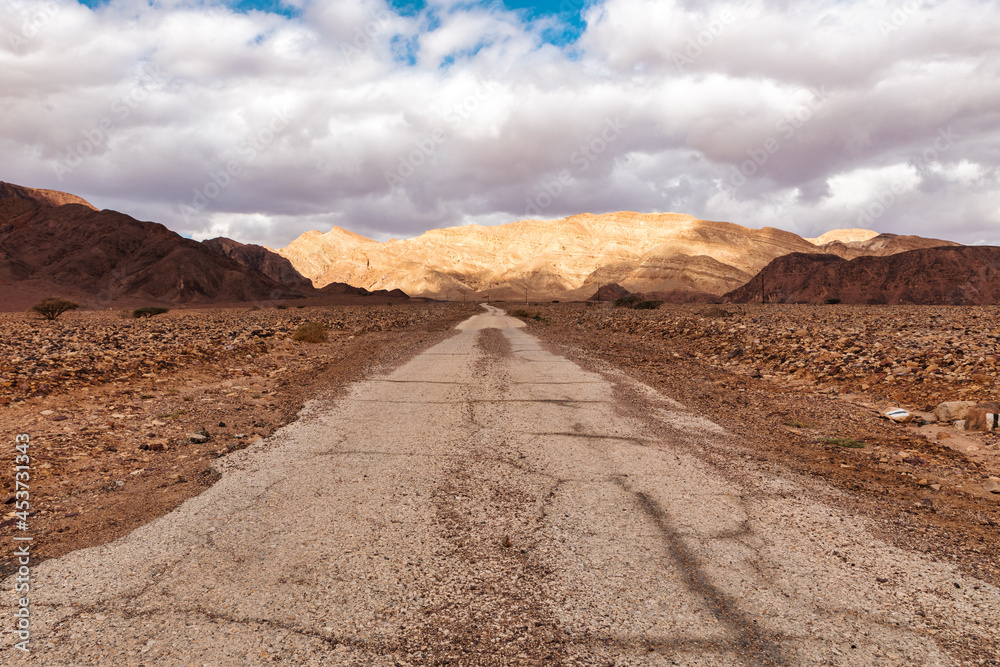 old asphalt road in the desert of the Negev