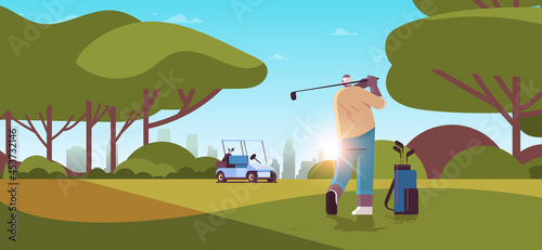 senior man playing golf on green golf course aged african american player taking a shot active old age concept