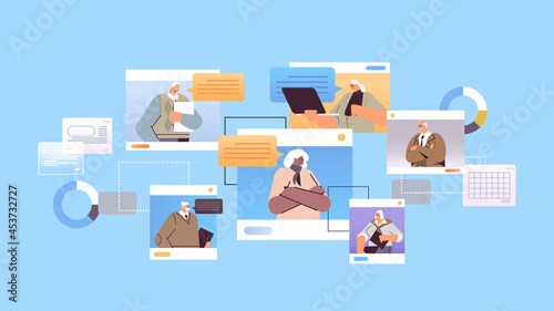 senior businesspeople discussing during video conference business people in web browser windows chat bubble communication