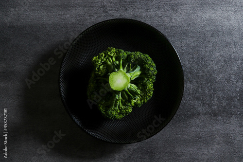broccoli on dark plate and dark mood with bird eyeview photo