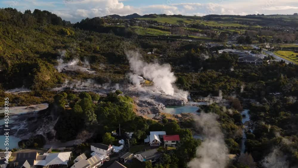 Aerial pull back from Pohutu Geyser reveal historic living Maori village and geothermal park in Rotorua, New Zealand Aerial pull back from Pohutu Geyser reveal historic living Maori village and geothermal park in Rotorua, New Zealand
