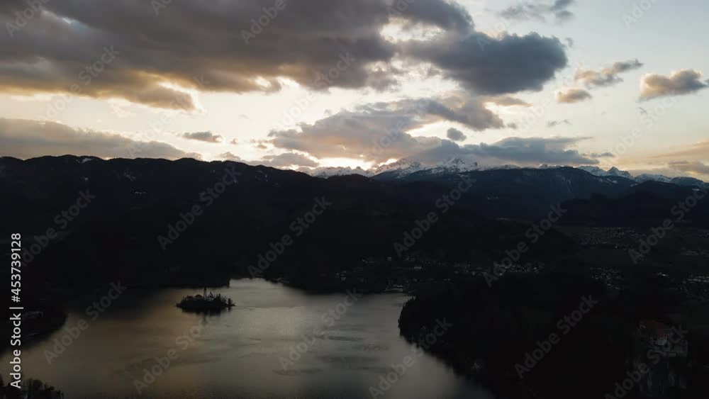 High altitude view over Lake Bled, Slovenia - snowy mountain background