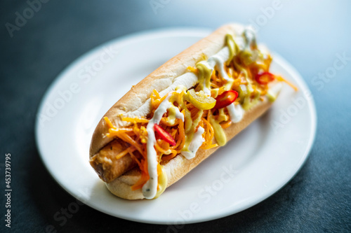 hot dog with french fries and sauce