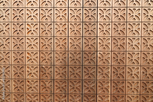 a wooden wall with a gingerbread pattern 