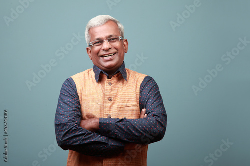 Happy smiling elderly man of Indian ethnicity