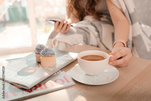 Young woman with cup of cof...