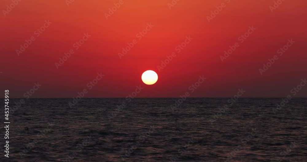 Time lapse of the sun setting in August on the sea of Sabaudia, Italy Time lapse of the sun setting in August on the sea of Sabaudia, Italy