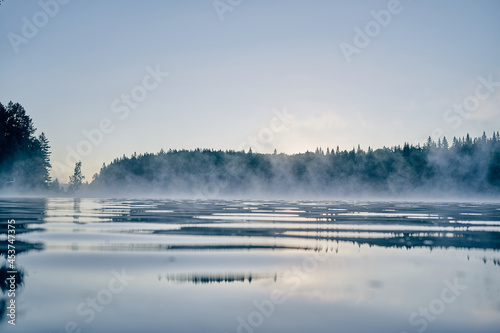 Early morning river view with fog
