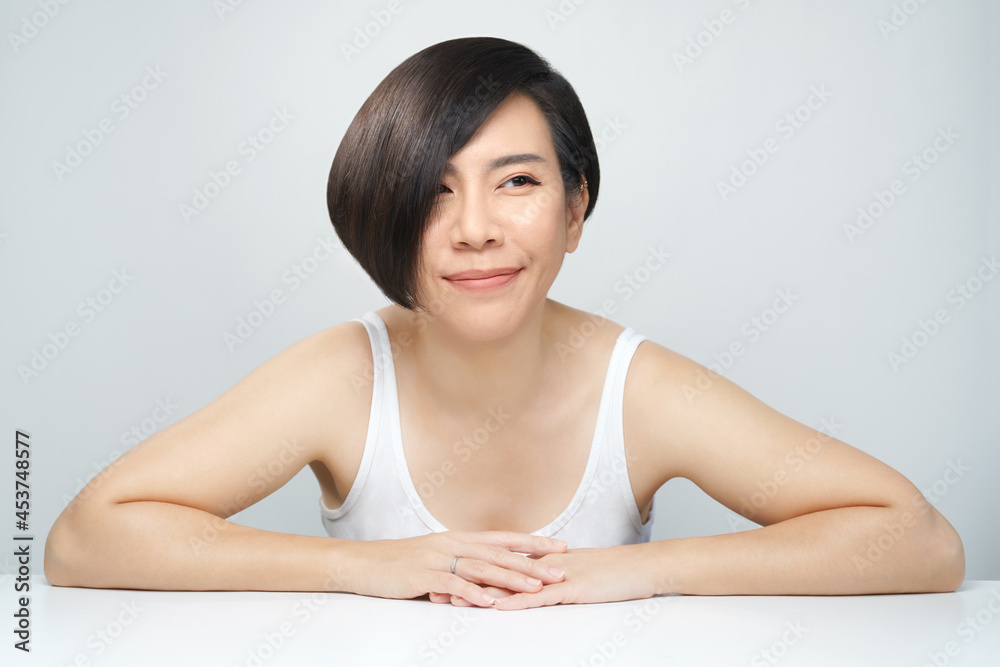 Skin radiance concept. Portrait of a beautiful 30s asian woman in white inner wear with flawless face, shiny healthy hair. K-beauty, Collagen, Products, Clinic, Plastic surgery, V shape, Skincare, 40s Skin radiance concept. Portrait of a beautiful 30s asian woman in white inner wear with flawless face, shiny healthy hair. K-beauty, Collagen, Products, Clinic, Plastic surgery, V shape, Skincare, 40s