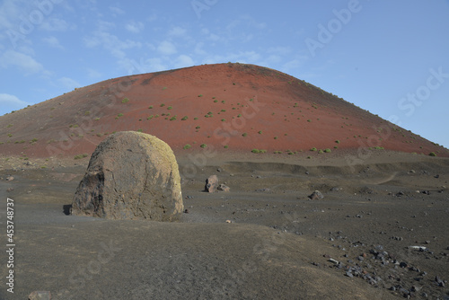 Big lava bomb near the red volcano Montana Colorada in Lanzarote, Spain photo