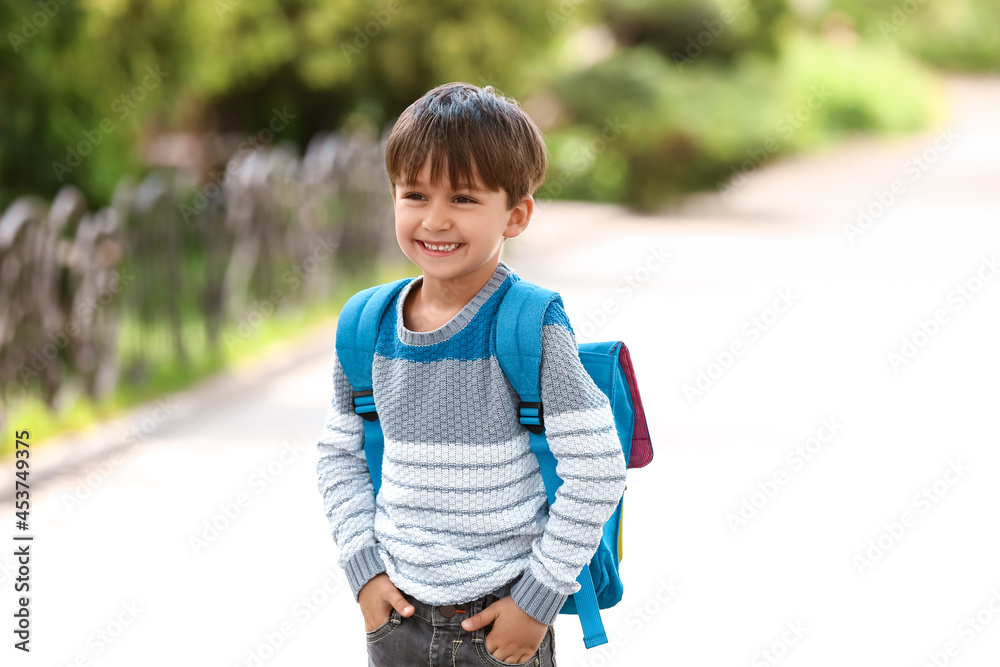 Little schoolboy with backpack outdoors Little schoolboy with backpack outdoors