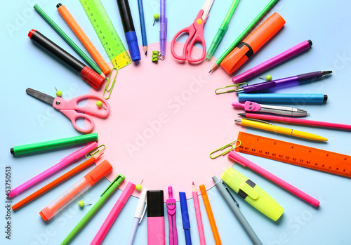 Blank paper sheet and stationery supplies on color background