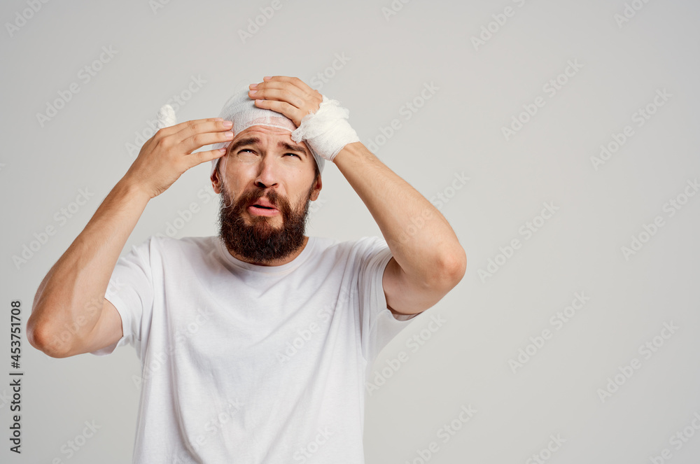 Man bandaged head and hand blood treatment Man bandaged head and hand blood treatment