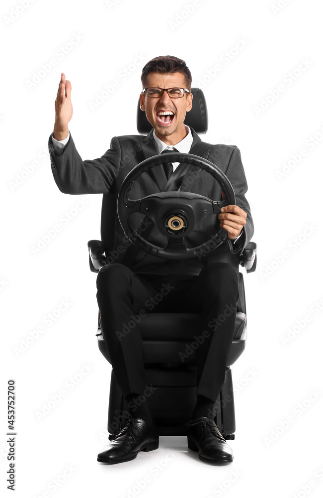 Angry businessman in car seat and with steering wheel on white background Angry businessman in car seat and with steering wheel on white background