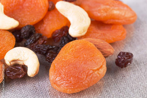 Variation of dried fruits and nuts: apricots, raisins, cashew, almonds.