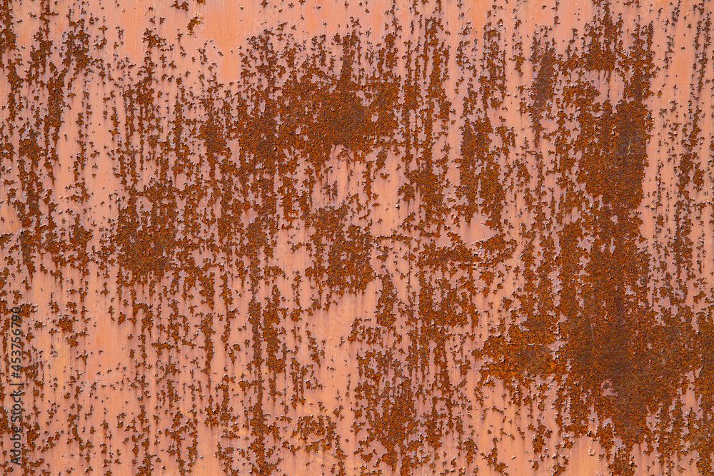 Background texture of rusty metal and red paint.