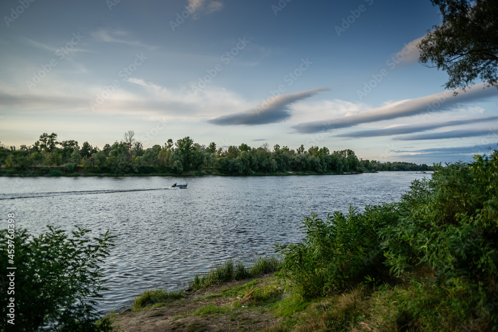 Beautiful view of Ukrainian Desna river, calm waters, dramatic skies