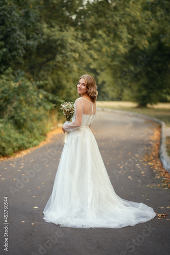 Photo of a beautiful bride in a white dress.