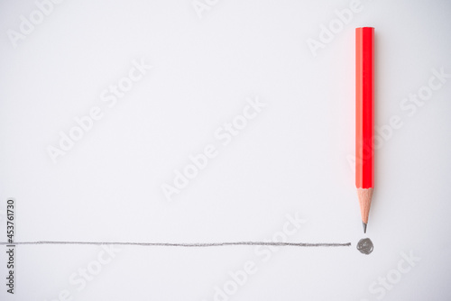 Flat lay of red colour pencil write line and end point on white paper background copy space. Business conclusion, creative idea, imagination and education concept. photo